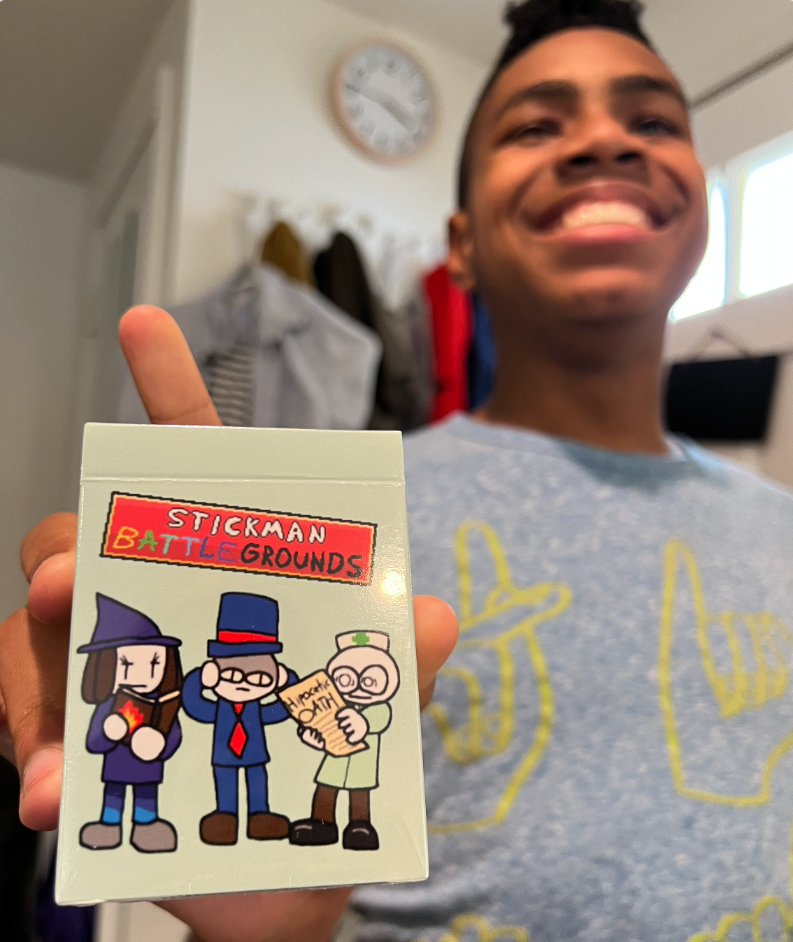 stickmanbattlegrounds-youngperson-holding-deck